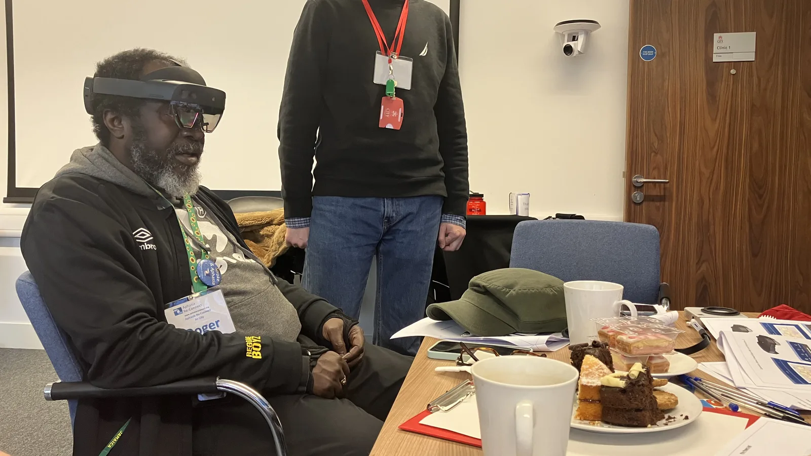 A participant with aphasia evaluating the Holo AAC prototype on a Microsoft HoloLens 2